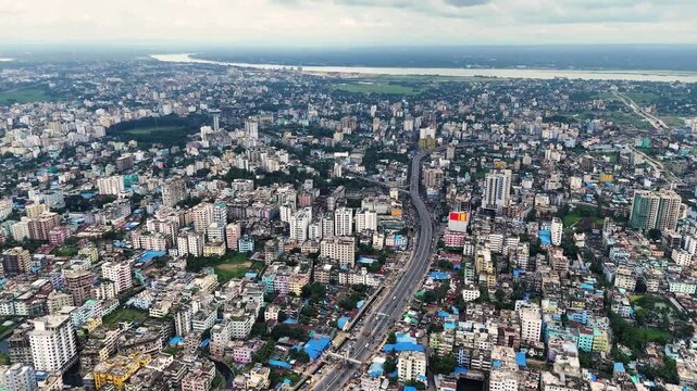 Aerial Panorama of Dense Urban City with Elevated Highway 4K