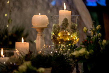 Warm Candle Light Composition With Glass And Natural Decor