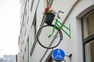 Creative Bicycle Wall Decoration With Flowers In Urban Street Scene