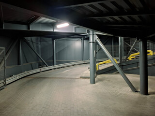 Car entrance leading to the supermarket parking lot