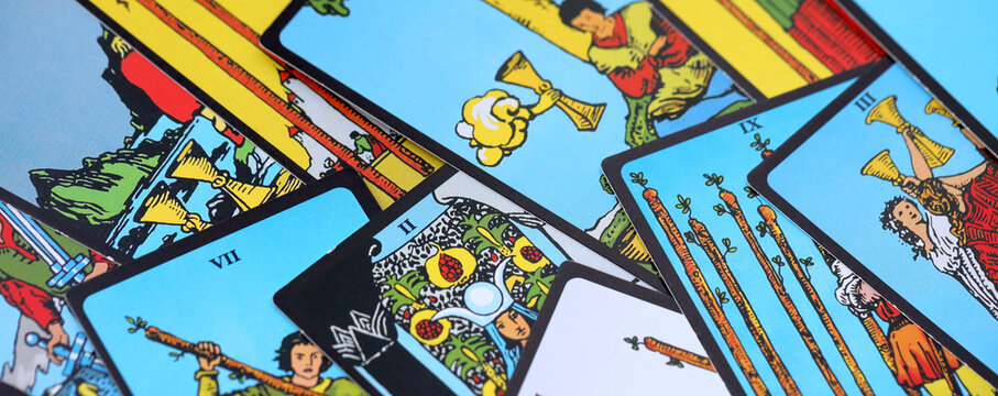 Tarot cards spread on a wooden table for divination and fortune telling