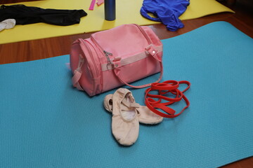 Ballet dance essentials with bag, shoes, and resistance band