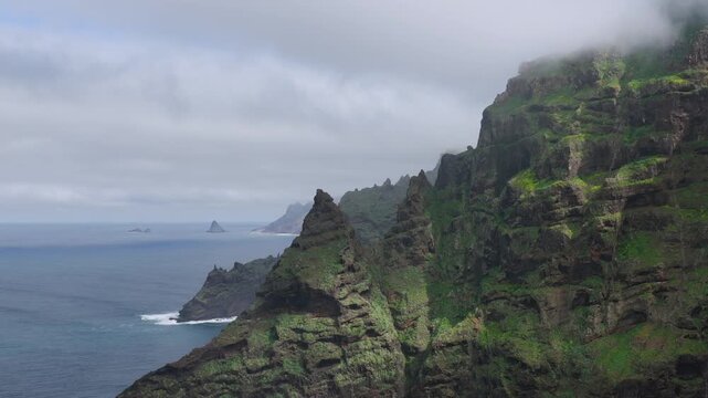 Aerial view over the rugged Anaga Massif peaks and the prehistoric barrancos of Punta del Hidalgo, Tenerife