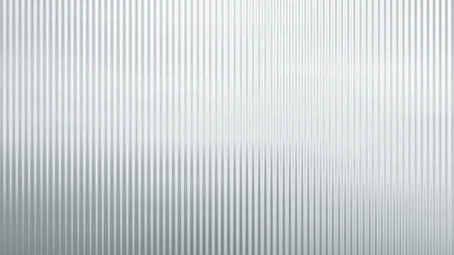 Close-up of decorative ribbed or fluted architectural glass pattern reflecting lights