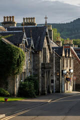 Traditional stone houses and ornate chimneys in a Scottish town
