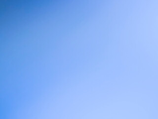 The photograph, taken with a camera, has a background color tone of blue and navy. The image contains white with shades of light blue, navy, dark blue, and black, creating a gradient of colors and lig