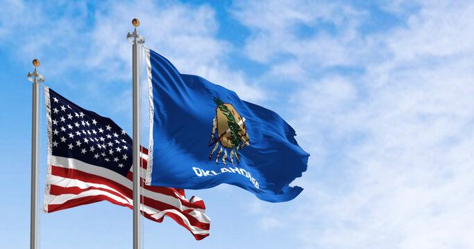 Oklahoma and USA flags waving together.