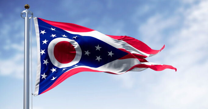 The Ohio state flag waving in the wind on a clear day