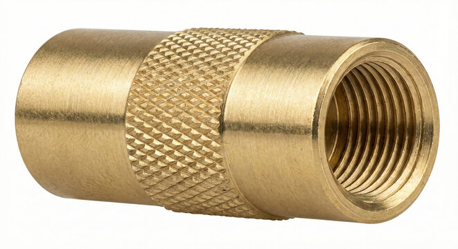 Extreme macro of a solid brass tire deflator tool with knurled grip and internal threads on white background.
