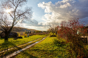 A dilapidated barn in a village in autumn