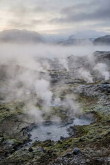 Volcanic crater landscape with steam and mist, geothermal nature background.generative AI