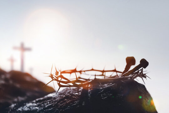 The cross and crown of thorns symbolizing the suffering and death of Jesus Christ, and the backdrop of the Passion Week on Calvary Hill.
