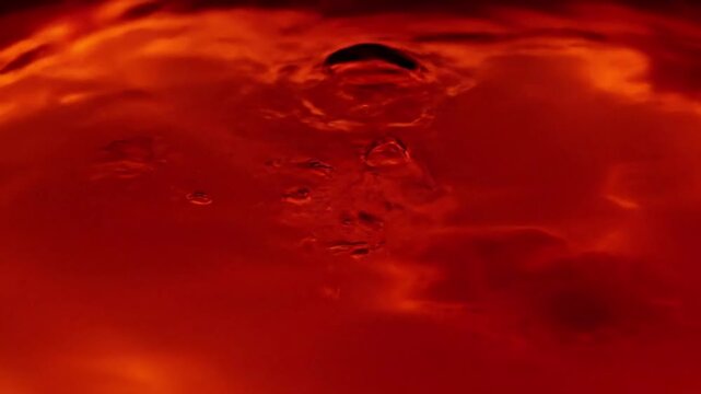 Subsurface Glow Macro view of light refracting through a dense, orange-red material, creating shimmering effects.