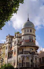 Obraz premium Elegant Neo-Mudejar architecture and tiled dome in Seville, Spain