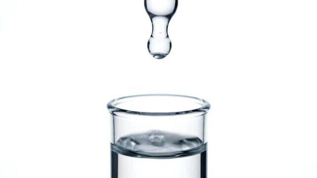 A scientific video showcases water droplets continuously falling and cascading through multiple clear glass containers, illustrating fluid dynamics, impact, and surface tension in a precise, slow-mot