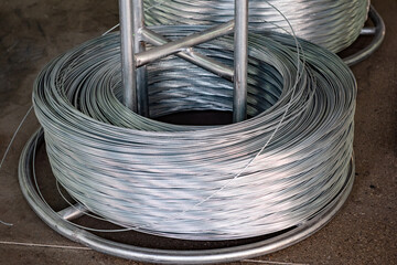 Close-up of Galvanized Iron Wire Raw Material Coils in the Machinery & Iron Factory Workshop