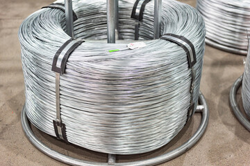 Close-up of Galvanized Iron Wire Raw Material Coils in the Machinery & Iron Factory Workshop