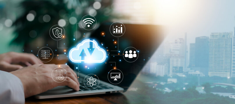 Business professional using laptop with cloud computing interface, data storage, cybersecurity, analytics and global network connection, digital transformation and smart technology concept.