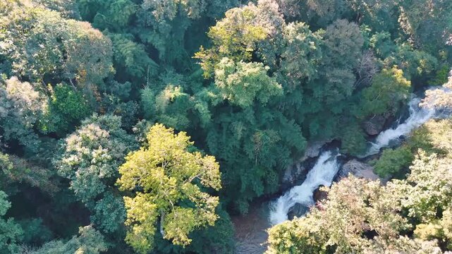 Aerial Mae Sae Waterfall cascading through jungle Chiang Mai Thailand
