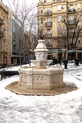 The Red Rooster a historic, white marble fountain topped with a bronze rooster statue located in Belgrade Old Town square