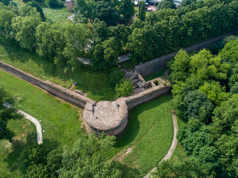 Aerial view of ancient walls and lush greenery intersect in a symphony of stone and verdant hues, creating an evocative landscape., Ferrara, Emilia-Romagna, Italy.