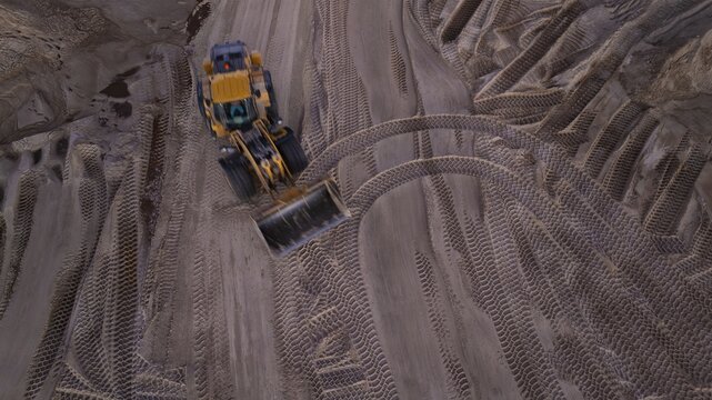 Aerial view of a front loader carving patterns in the sand, West Palm Beach, Florida, United States.