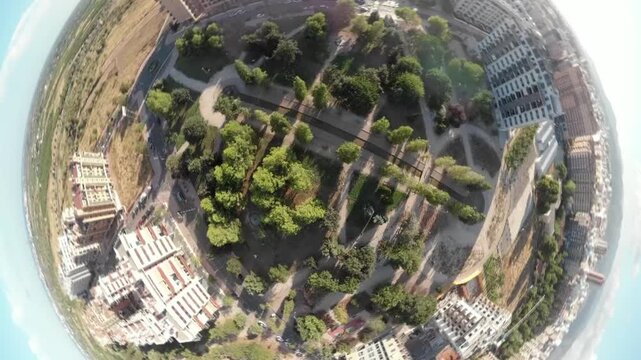 Blurred drone view of a city park and residential buildings with dynamic zooming and planet-like transitions for an environmental theme