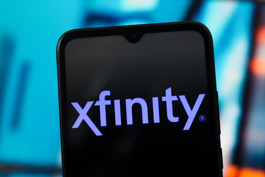 In this photo illustration, Xfinity logo is seen displayed on a smartphone screen.