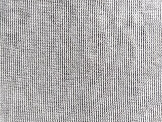 ​Gray waffle knit fabric texture background, seamless cotton textile pattern, close-up macro. © Putu