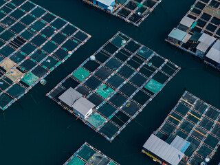 Floating fish farm platform with roofed shelter in open water © Parilov