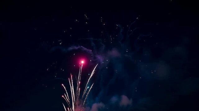 Majestic fireworks display against dark night sky festive celebration pyrotechnics exploding bursts of light grand finale independence day vibrant colors