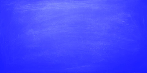 A blue grunge abstract background features an aged paint texture on a vintage paper canvas with a dark rough pattern and light green accents for a dirty textured wall design