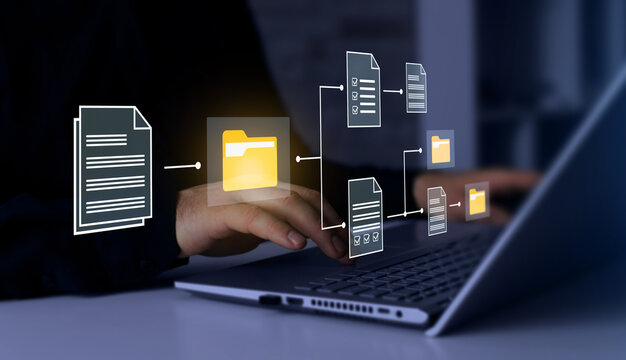 Business professional working on laptop with virtual document management system interface. Digital file organization concept with connected folders, online database, workflow automation and cloud data