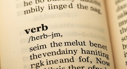 Close-up of a dictionary page defining the word verb.