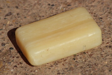 A single bar of pale yellow soap
