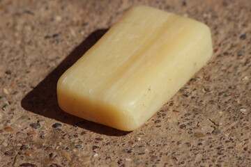 A single bar of pale yellow soap
