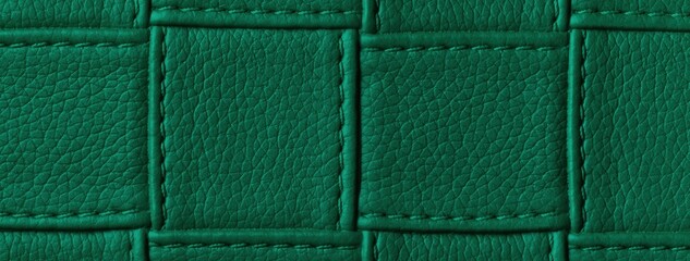 Fototapeta premium Texture dark emerald leather background with quilted stitched pattern, macro. Abstract deep green upholstery surface