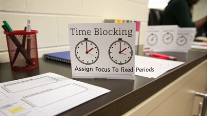 Time Blocking Sign with Clocks on a Desk