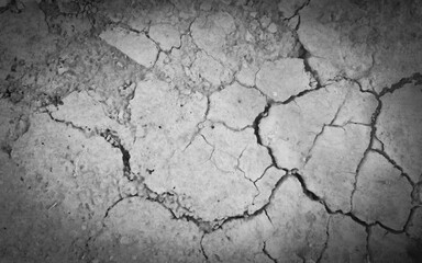 Fototapeta premium Dried desert land without vegetation. Vignette. Natural background in black and white.