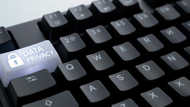 Data privacy protection on keyboard key highlights personal data security and cybersecurity awareness to prevent spyware attacks and safeguard digital information from threats in digital cybersecurity