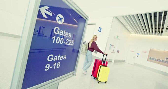 Traveler Navigating Airport Terminal with Luggage
