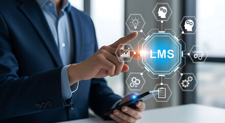Obraz premium Businessman holding holographic LMS Learning Management System icons