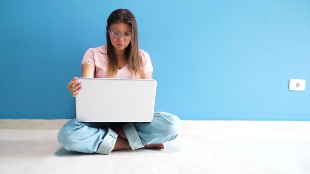 person working with a laptop, woman typing on notebook