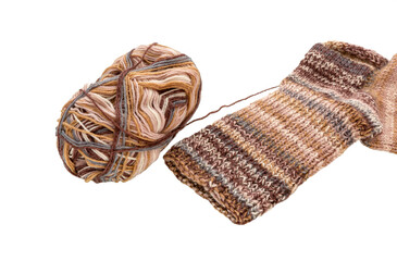 Yarn of multicolored knitting thread and a knitted sock with a pattern.