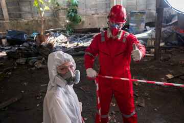 person in mask. Hazardous control related to factory chemicals. Employees are disposing of harmful substances. in a chemical protective suit in a factory