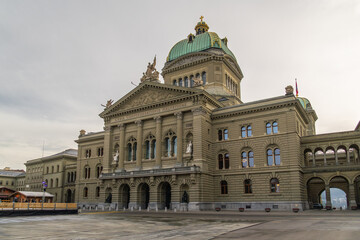 Obraz premium North Facade of Federal Palace of Switzerland on Cloudy Day and Empty Bundesplatz. Bern, Switzerland