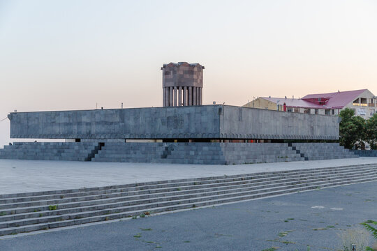View of the striking Mother Armenia monument, a Soviet-era sculpture of imposing grey stone, standing proudly against the pale sky, Yerevan, Yerevan, Armenia.