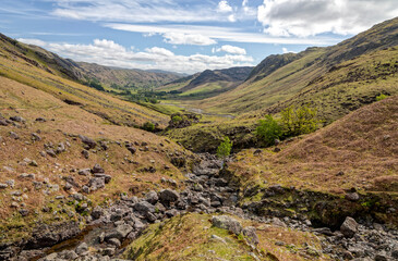Fototapeta premium oxendale and the oxendale beck in great langdale lake district cumbria uk with markeens and kettle crag on the right the langdale fell in the left distance and side pike centre sunny day no people