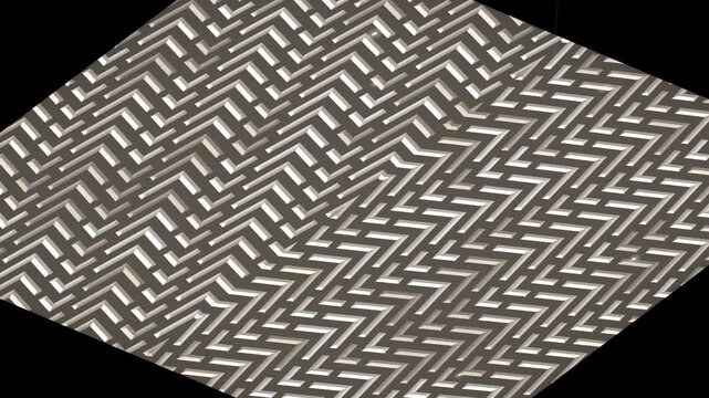Close-up view of a gray and white herringbone pattern on a solid black background with geometric design.