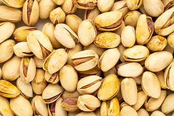 Fototapeta premium Unsalted pistachios, macro, top view.